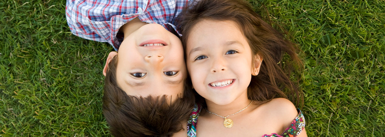 Happy children who are safe, secure and covered by life insurance.